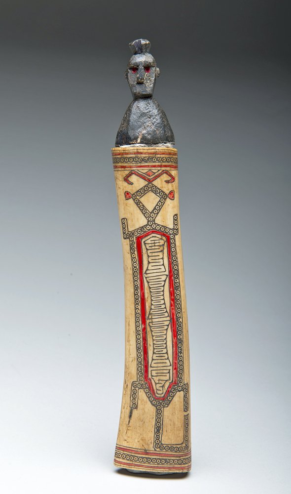 Indonesian Lime Container - Charm Idol: Timor, Indonesia. Lime Container with charm Idol and bone with lizard design in red and black colors. 9"H x 1-3/4"W. Provenance: Ex-private New Hampshire Collection All items legal to buy/sell under U