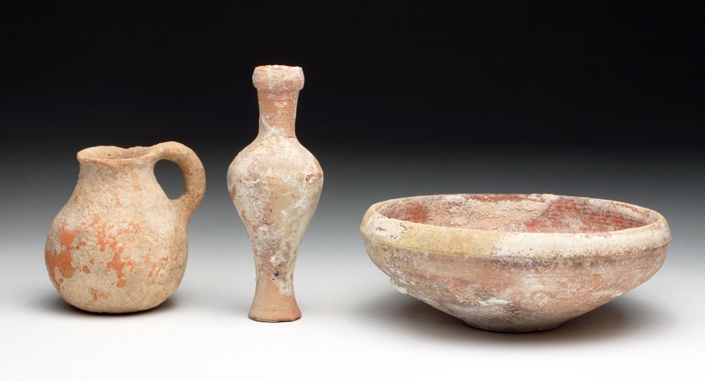 3 Iron Age Holy Land Vessels, ex-Barakat: From the ancient Near East, Holyland, found in Israel, ca. 800 to 500 BCE. Lot consists of three terracotta vessels, including spindle jar, bowl and small pitcher. Each in redware pottery. Bowl measur