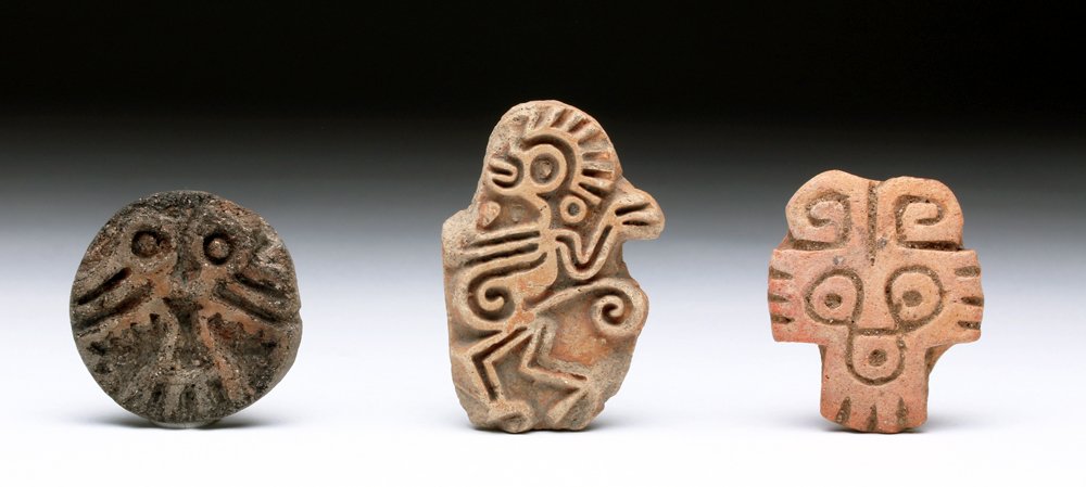 Lot of 3 Aztec Stamp Seals - Monkeys and Bird: Pre-Columbian, Mexico, ca. pre-1500. Three terracotta stamps created by the Aztecs. One features a lively, abstract rendering of a dancing monkey with remains of cinnabar pigment; another the wild-eye