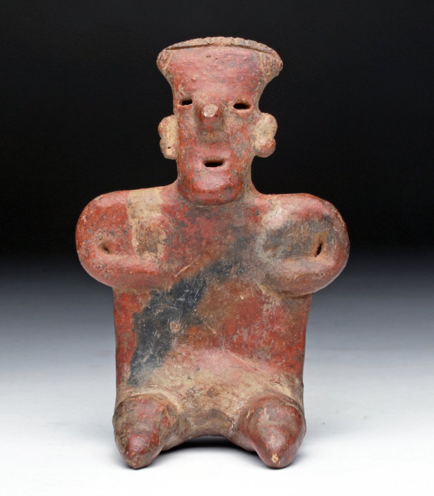 Nayarit Seated Female, San Sebastian Type: Pre-Columbian, West Mexico, Ca 200 BCE/CE. Pottery flat figure with nearly triangular head, hands held to her ribs, small breast in typical shoulder position, painted in red, black and tan pigment. Si