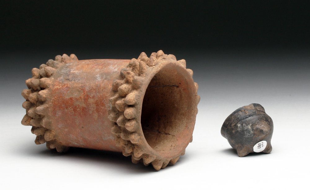 Lot of 2 Pre-Columbian Terracotta Items: West Coast Mexico, Colima region, ca. 200 BCE / 200 CE. First, pottery cup in the form of a native cactus. Covered in redware slip, 5" H. Along with miniature blackware tripod - probably in the form o