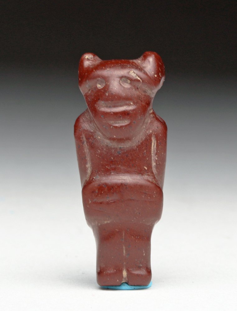 Rare Pre-Columbian Tairona Anthropomorphic Bead: Colombia, Tairona, ca. 900 to 1500 CE. Fun red stone bead in the form of a standing transformational figure. Features mostly human, but ears certainly looking animal in nature. Szie: 1-1/4"H (3 cm) . 