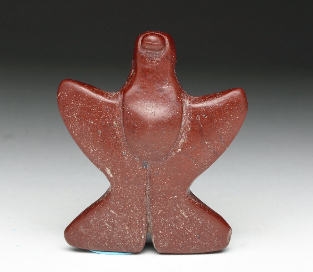 Pre-Columbian Tairona Stone Pendant - Eagle: Colombia, Tairona culture, ca. 900 to 1500 CE. Lovely stone carving of an eagle. Nicely carved in red stone in the form of an eagle with its wings spread, large raised breast, drilled bi-conically thr