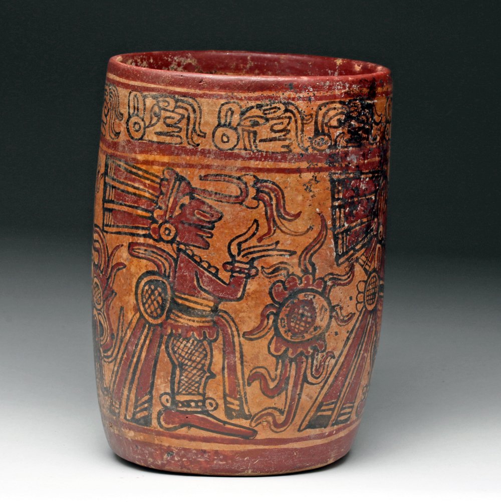 Colorful Mayan Copador Cylinder: Pre-Columbian, Western Honduras, Mayan, Copador, Late Classic Period, ca. 750-950 CE. Likely used for the ceremonial cocoa drink, terracotta vessel painted in a lovely polychrome of red, tan, and blac