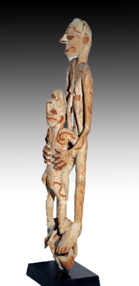 PNG Asmat Wood Ancestor Post: Papua New Guinea, mid-20th century CE. Carved wood totemic figures of elongated abstracted forms with archaic features and painted surface remains. Custom mounted. Size: 35"H. Provenance: Ex-estate of