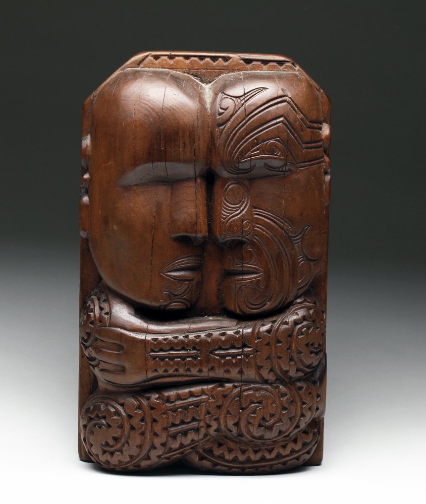 Published Maori Relief Sculpture of Primal Couple: New Zealand, Maori, ca. 1st or 2nd decade of the 20th century CE. Maori indigenous culture has a rich tradition in tattooing, legends, and art. All come together in this wooden relief carving of a cou