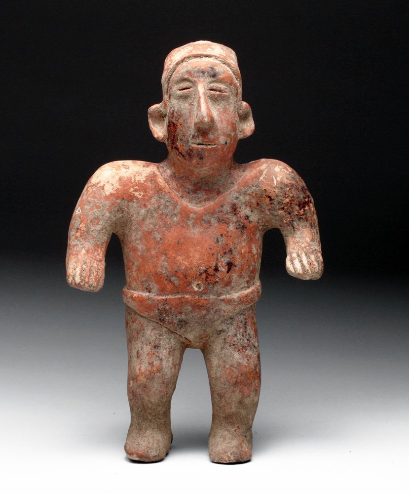 Jalisco Pottery Standing Figure: Pre-Columbian, West coast Mexico, Jalisco region, ca. 300 BCE to 300 CE. Pottery standing figure of a male. He stands with arms at his sides, shoulders raised, wearing loin cloth and necklace along wi