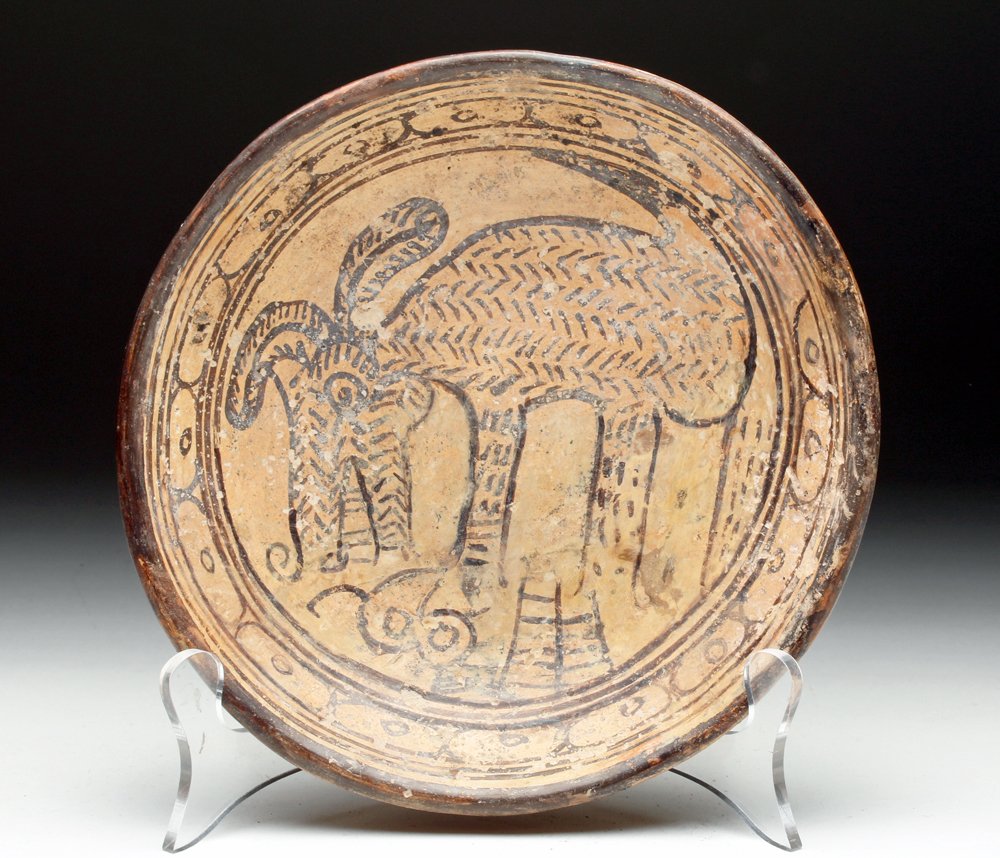 Mayan Pottery Bowl: Maya Territories, most likely Yucatan Peninsula, ca. 5th to 8th century CE. Unusual pottery bowl, of shallow form, painted on the interior with zoomorphic creature, its fur clearly delineated, tail ra
