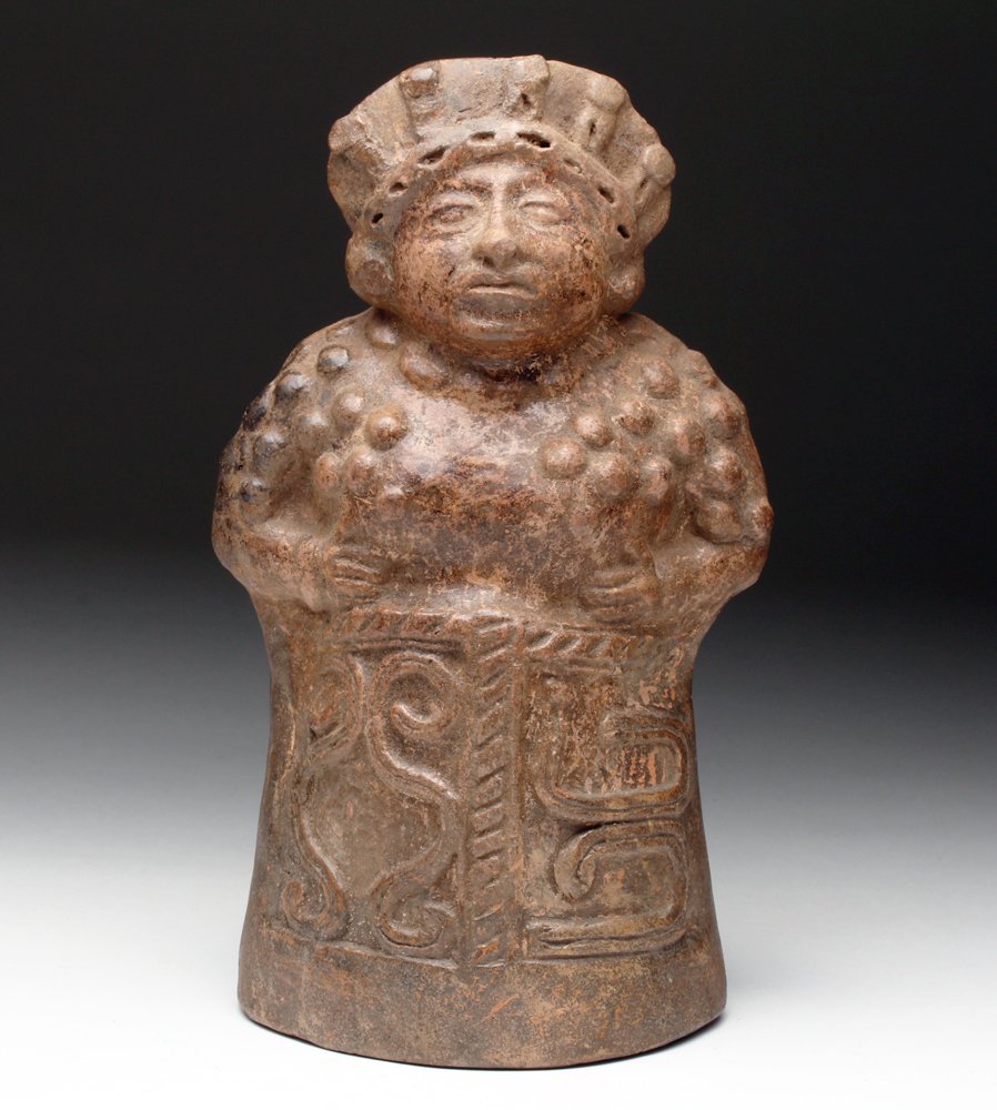 Fine Mayan Molded Terracotta Female Figure: Pre-Columbian, Mayan, ca. 600 to 850 CE. Fashioned with braided fillet headdress and necklace, wearing ear spools and a fine tunic with shoulder patterns. Dignified facial expression. Size: 8-1/4"H. P