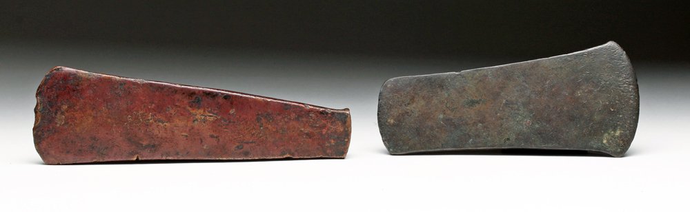Two Michoacan / Aztec Copper Ax Heads: Mexico, Michoacan and Aztec, ca. 1200 to 1500 CE. Fine pair of copper ax (axe) heads. Each with sharpened leading edge and both showing signs of use. Tarascan version with broader crescent-shaped blad