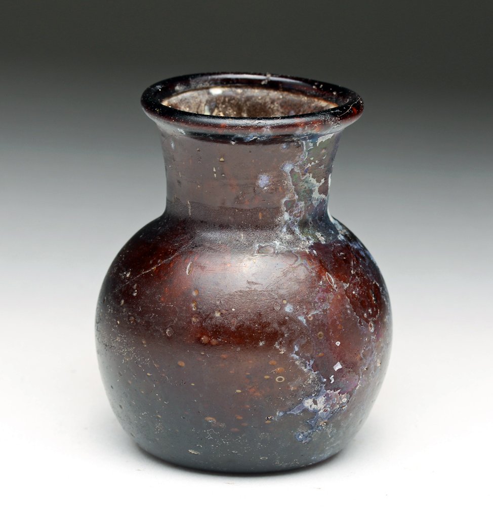 Roman Amber Glass Jar - Beautiful Coloration!: Roman Empire, Levant, ca. 1st to 3rd century CE. Another stunning example of Roman glass-making skill! Rare deep amber bottle with bulbous base, slightly flared neck and rolled rim, underside with dee