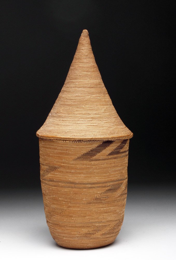 Finely Woven African Tutsi Lidded Basket: Central Africa, Rwanda, first half of the 20th century. An exceedinlgly tight and well woven basket from the Tutsi tribe. Made of woven plant fibures in shades of tan and brown with subtle design on e