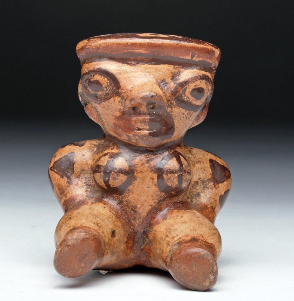 Costa Rican Guanacaste Venus Figure: Pre-Columbian, Costa Rica, Guanacaste, Nicoya Region, ca. 200 to 600 CE. This female venus figure possesses the elegant stylings of the Guanacaste-Nicoya artisans. The striking trichromatic ceramic st