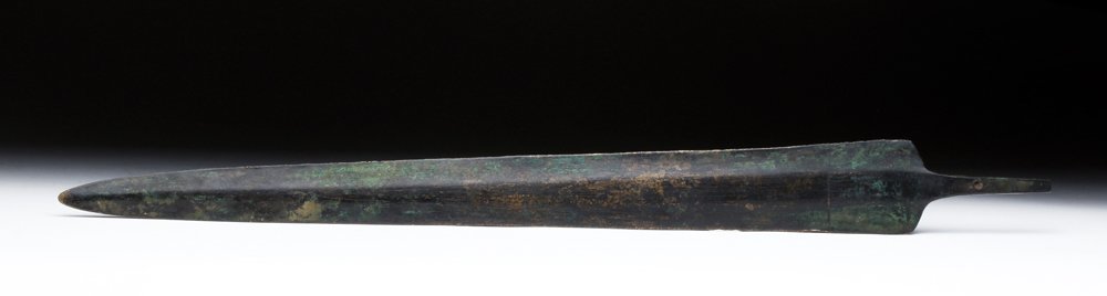 Superb Luristan Bronze Tanged Sword: Central Asia, northern Iran, Luristan culture, ca. 1100 to 800 BCE. A truly fabulous bronze sword with long, thin slightly tapered balde sharpened on each side, tapered tang with single hole for inser