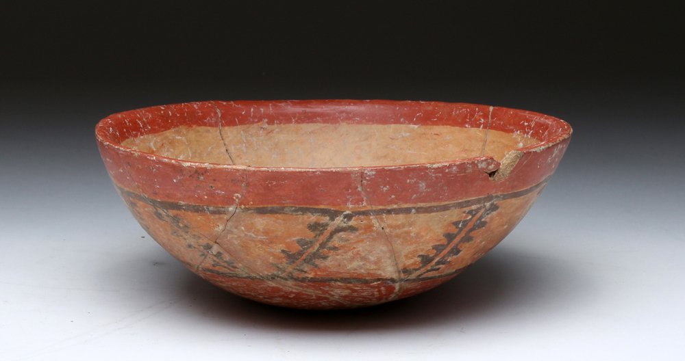 Mayan Polychrome Pottery Bowl: Mayan Territories, Honduras or El Salvador, ca. 550 to 900 CE. Decorated pottery bowl painted on the exterior with upper and lower registers of red, central band of black over light orange "stitches."