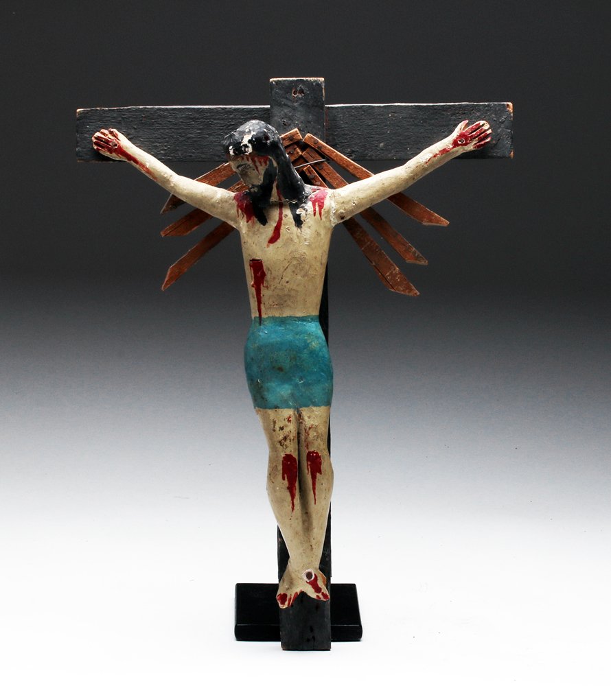 1920s Mexican Polychrome Crucified Christ, ex-Historia: Mexico, ca. 1925 CE. A hand carved figure of Jesus Christ in the crucifixion position, painted in many colors for a striking finish. The sculpture brilliantly captures the drama and sorrow of the trag
