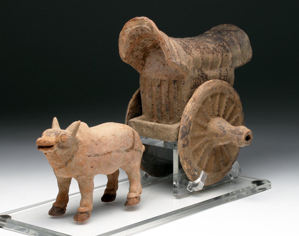Han Dynasty Terracotta Bullock Cart Mingqi: Far East, China, Han Dynasty, ca. 206 BCE to 220 CE. Funerary object made from terracotta with handpainted details in black. The ancient Chinese buried precious items with the elite in order to ensure