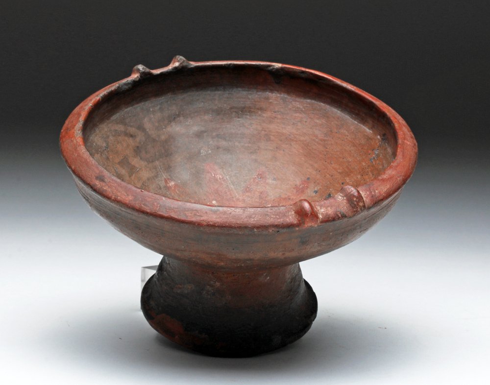 Narino Pedestal Dish, Stars and Monkeys: Pre-Columbian, Colombia, Carchi-Narino, Capuli Complex, ca. 850 to 1500 CE. Ceremonial pedestal bowl with slightly flaring foot, twin lugs on each side of rim, interior decorated with red 11-pointed s