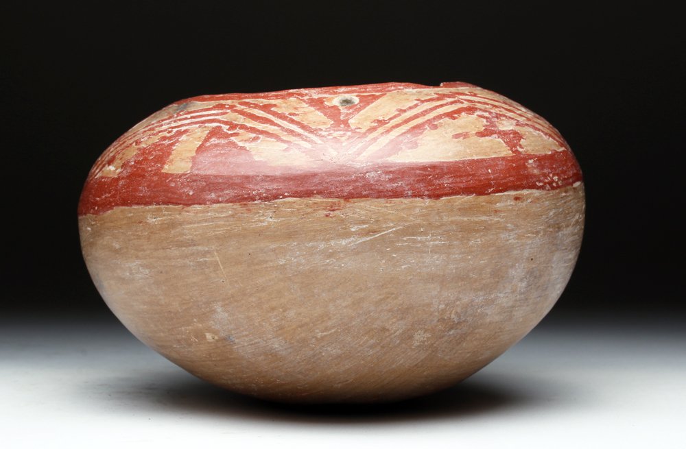 Chupicuaro Pottery Olla: Pre-Columbian, Western Mexico, ca. 300 BCE. Pottery olla from this fascinating and under-appreciated culture. Rounded jar decorated with red geometric patterns and two ancient suspension holes. 6-5/8"