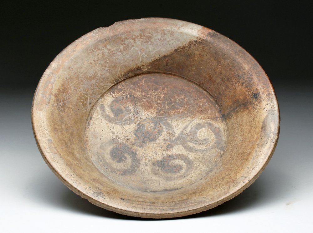 Mayan Tripod Vessel from Yucatan Peninsula: Pre-Columbian, Mayan territories, Yucatan Peninsula, ca. 400 to 600 CE. Mayan brownware tripod vessel, showing distinct Teotihuacan influence with slab feet, decorated on the interior with abstract 5-
