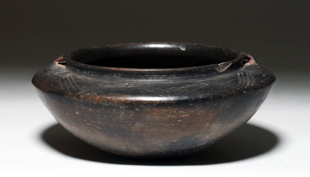 Chupicuaro Blackware Pottery Jar: Pre-Columbian, Chupicuaro, 500 BCE to 300 CE. This is a black slip painted redware pot with linear designs around the flat shoulder and two small handles. The artwork on this pot is pretty and the wor