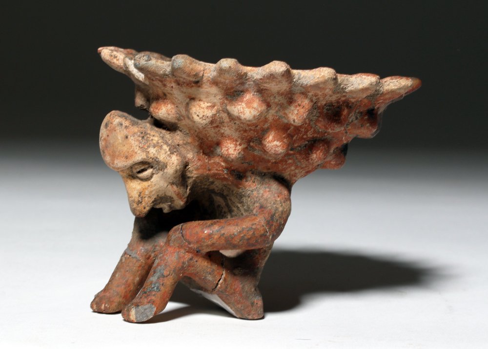 Colima Pottery Incensario Held by Figure: Pre-Columbian, West Mexico, Colima, ca. 300 BCE to 300 CE. This is an interesting figure of a crouched man holding a decorated bowl that may have been used to hold incense or some other kind of burnin