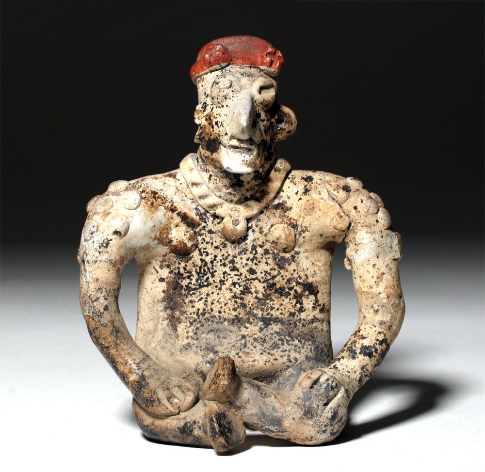 Jalisco Pottery Seated Female: Pre-Columbian, West Mexico, Jalisco, ca. 300 BCE to 300 CE. This is a highly abstract female figure with shoulder decorations, a necklace, and a headdress. Figures like this one would have been placed