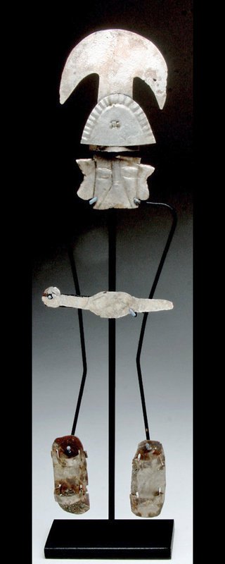 Rare Sican Silver Lord with Dangling Sandals: Pre-Columbian, Peru, Lambayeque / Sican culture, ca. 800-1000 CE. The Sican people made significant technical advances in metalwork and focused their artistic proclivities in this medium. Archaeologis