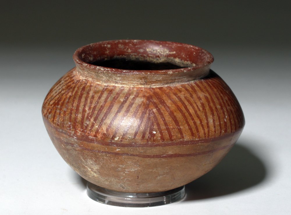 Colombian Narino Decorated Pottery Bowl from Quilla: Pre-Columbian, Colombia, Narino, ca. 850 to 1500 CE. A lovely, hand built terracotta bowl decorated on the shoulder with red striations, a textile or basketweave inspired motif, created via negative r