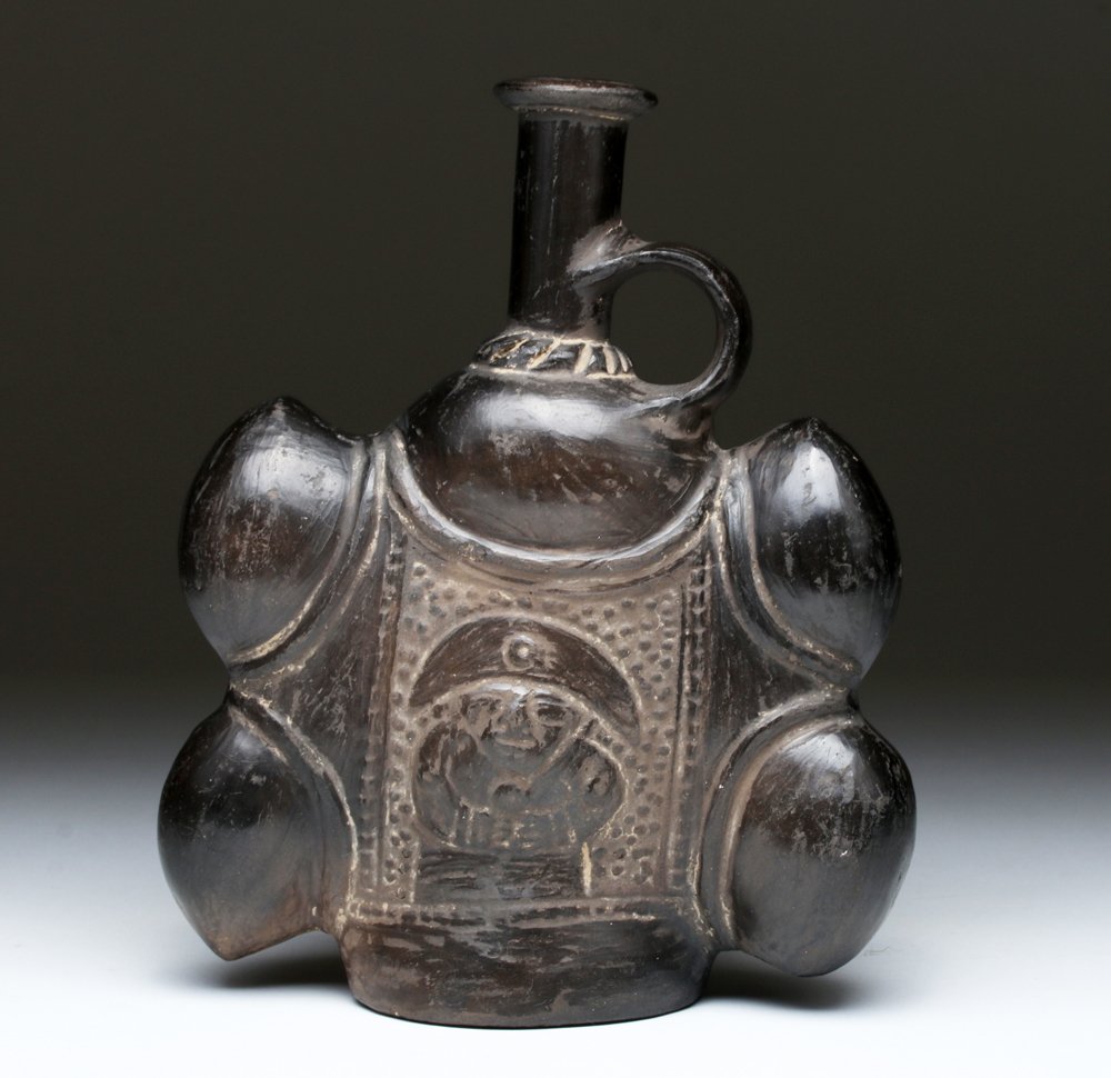 Late Inca Blackware Pottery Spattered Vessel: Pre-Columbian, Peru, Late Inca, ca. 1500 to 1600 CE. This piece shows colonial Spanish influence but was made by Inca artisans; artwork shows standing lord with stippled background, surrounded by four