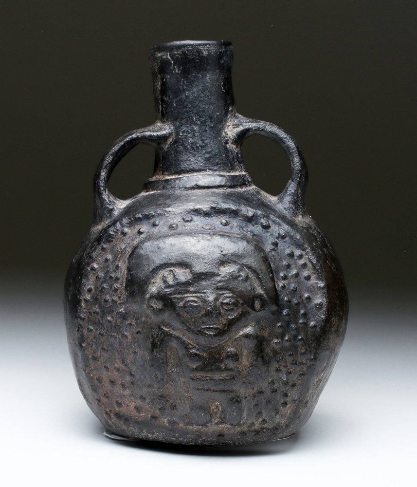 Chimu Blackware Pottery Spouted Vessel: Pre-Columbian, Late Inca, Chimu, ca. 1500 to 1600 CE. This piece shows colonial Spanish influences but was made by Inca artisans. The artwork on it depicts a standing lord with a stippled background o