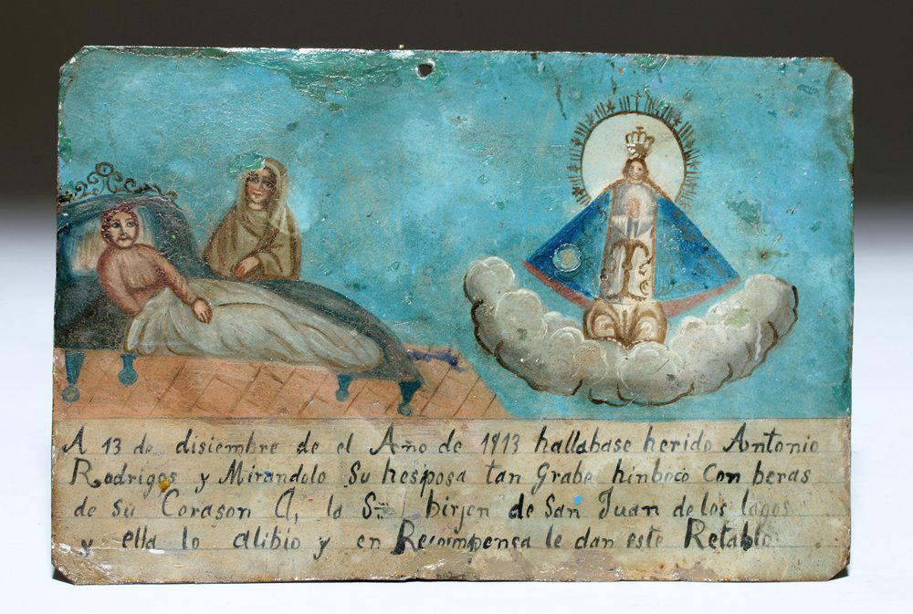 1913 Mexican Ex Voto - Virgin de San Juan de los Lagos: Latin America, Mexico, ca. 1913 CE. Dedicated to the Virgin of San Juan de los Lagos (of the Lakes) depicting a shrouded woman at her injured husband's bedside alongside a vision of the Holy Virgin Ma