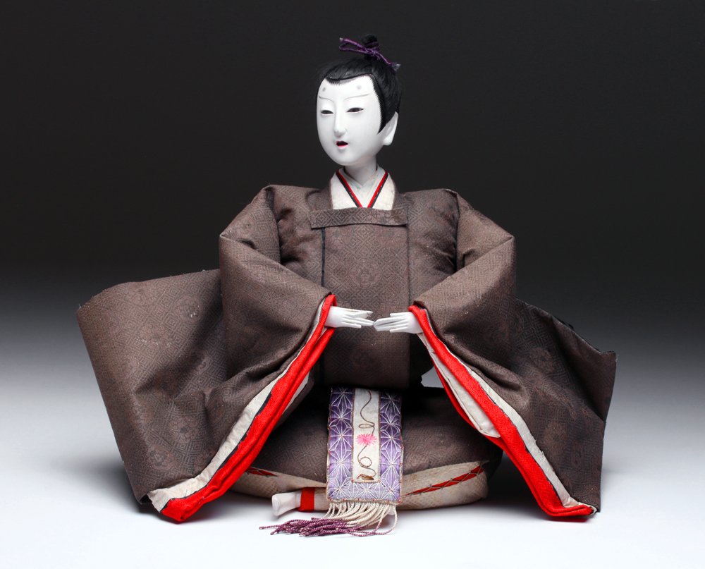 19th C. Japanese Edo / Meiji Imperial Character Doll: Japan, Late Edo / Meiji, ca. 1860 to 1900 CE. A handsome Imperial character doll, probably representing a young boy prince. He is wonderfully attired in an imperial robe in period costume, with his fa
