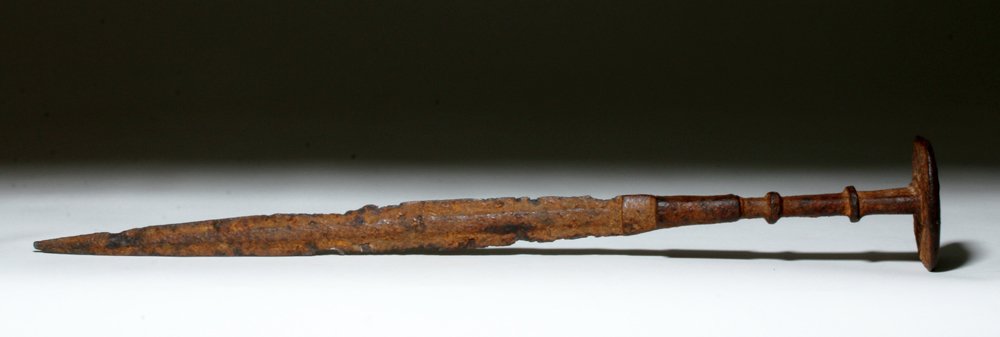 Rare Lristan Iron Disc Pommel Sword, ex-Piscopo: Luristan, modern day Iran, ca. 900 to 700 BCE. This is an iron shaped sword blade and handle with a flat, disc-shaped pommel. The rest of the handle would likely have been covered with bronze, bone, w