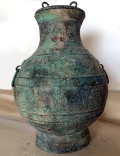 Ancient Chinese Han Dynasty Bronze Hu: Far East, China, Han Dynasty, ca. 206 BCE to 220 CE. An elegant, pear shaped vessel with a body that swells to create an almost spherical belly that resolves to a gracefully contracting neck, all