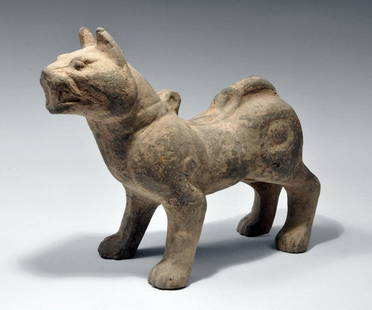 Ancient Chinese Han Dynasty Pottery Dog: Far East, China, Han Dynasty, ca. 206 BCE to 220 CE. A proud pup with a strong, protective stance and a fierce disposition, made from unglazed baked terracotta. During the Han Dynasty, such ceramic