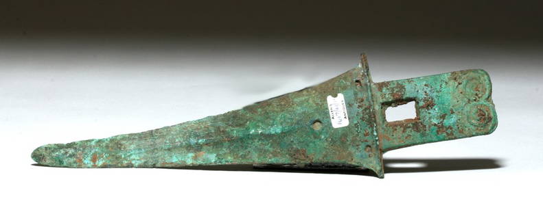 Chinese Han Dynasty Bronze Pole Axe, ex-Piscopo: Far East, China, Han Dynasty, ca. 206 BCE to 220 CE. A large cast bronze Han Dynasty pole axe with a lengthy dual-edged blade, a pronounced blood ridge on both faces, each ridge punctuated by an