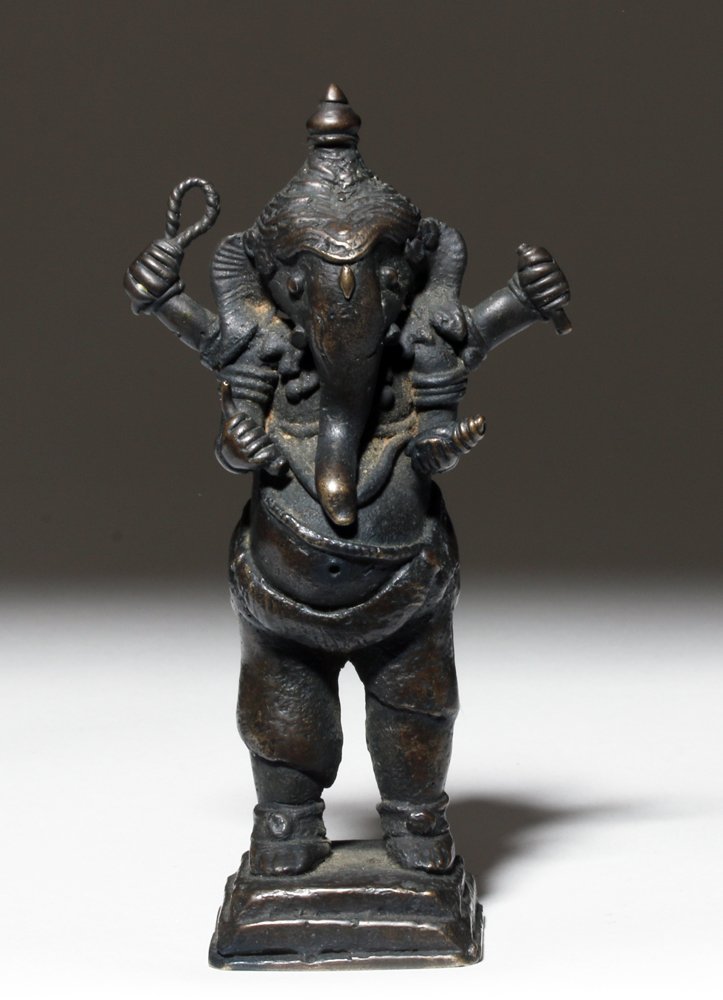 19th C. Indian Bronze Ganesh Figure, ex-Arnovick: Central Asia, India, ca. mid to late 19th century CE. A sweet solid cast bronze statuette of the elephant-headed deity Ganesh, the Lord of Good Fortune who provides rich fortune, success, and general 