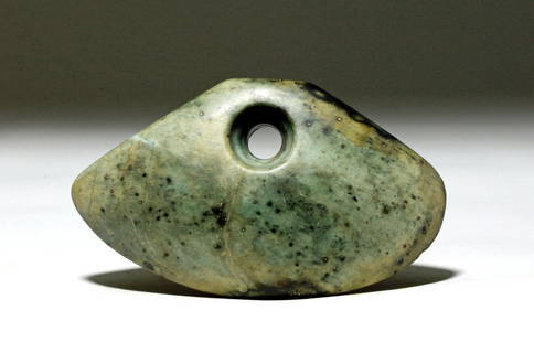 Lg Ancient Chinese Shan Jade Object, ex-Arnovick: China, Shang Dynasty, ca. 1558 to 1046 BCE. This is a large jade (nephrite) object from early Chinese history. It has a three-dimensional trapezoid shape and a smooth hole drilled through its