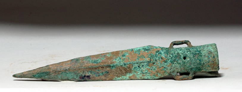 China Eastern Zhou Dynasty Bronze Spearhead, ex-Piscopo: China, Eastern Zhou, 770 to 256 BCE. This is a bronze spearhead with a pleasing triangular shape and two squared-off loops on the body of the socket. This spearhead was made during a time of great