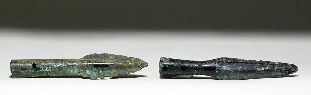 Pair Chinese Bronze Age Spearheads, ex-Piscopo: China, Eastern Zhou, 770 to 256 BCE (for the larger), and Warring States, 475 to 221 BCE (for the smaller). This is a pair of socketed bronze spearheads with two very distinctive patinas,