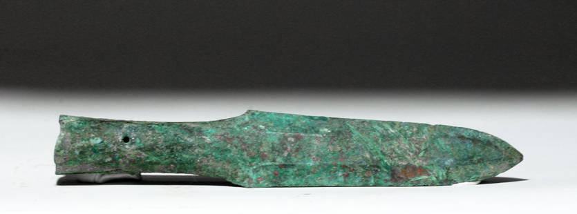 Ancient Chinese Warring States Spearhead, ex-Piscopo: China, Warring States Period, 475 to 221 BCE. This is a beautiful example of a spearhead with remarkable heft and a beautiful multi-faceted patina. The patina even has fibers embedded in it,