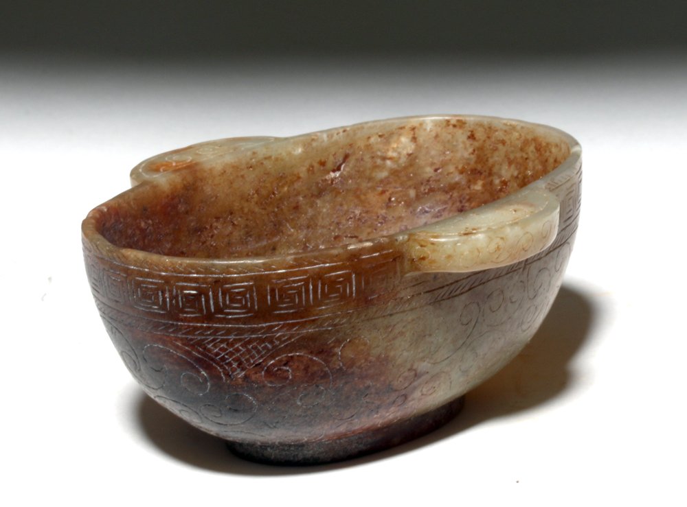 Chinese Ming Dynasty Jade Ear Cup: China, Ming Dynasty, China, ca. 1368 to 1644 CE. This is a large reddish brown and grey "ear cup", a particular type of bowl with "ear-shaped" handles flush with the rim that was used for drinking win