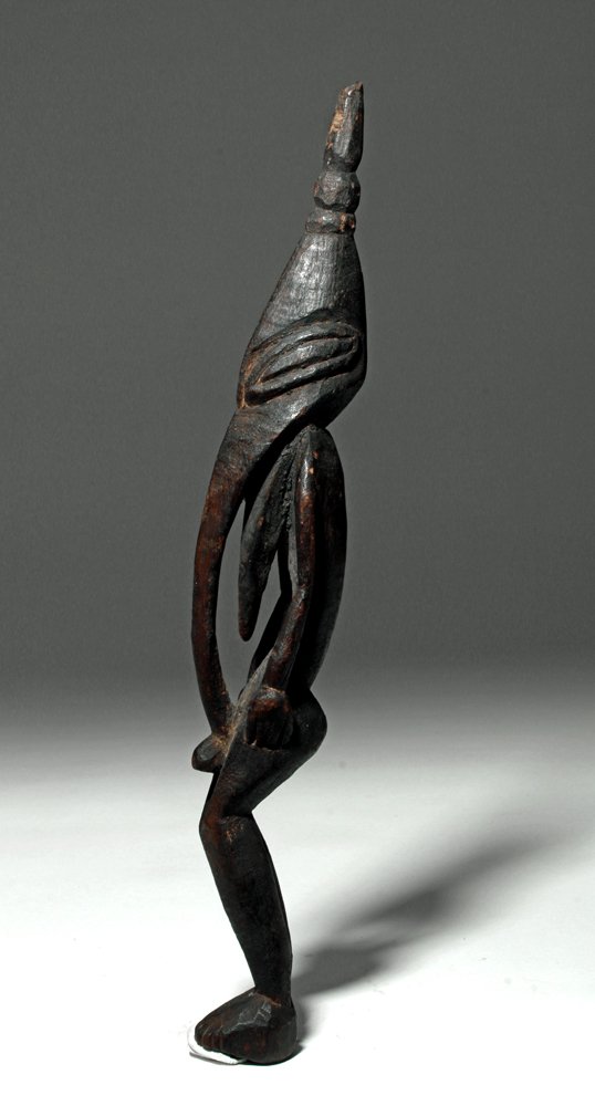 PNG Sepik River Wood Ancestor Figure, ex-Arnovick: Papua New Guinea (PNG), Sepik River, South Pacific, ca. 1st to 2nd quarter of the 20th century. Fine wooden male ancestor figure. Carved with exaggerated mask with beaked nose, tongue extended, nude s