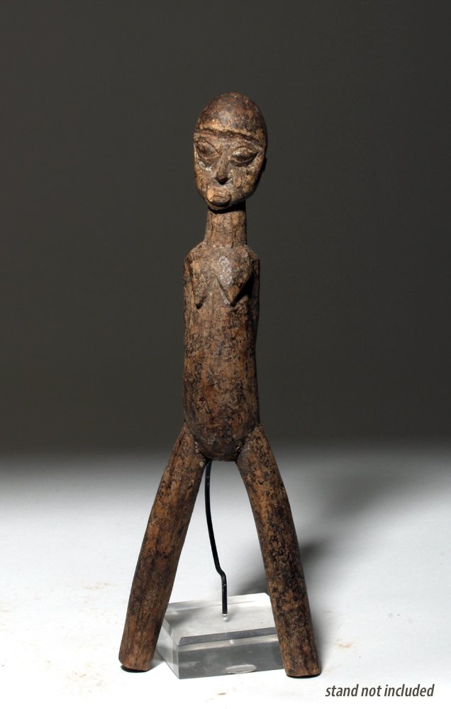 20th C. African Lobi Wood Slingshot, ex-Arnovick: Africa, Burkina Faso, Lobi culture, ca. 1st quarter of the 20th century. Fine and clearly very early wooden slingshot. Carved in the form of a standing nude female, her thin arms are behind her back, 