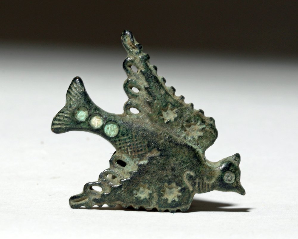 Fine Romano-British Enameled Fibula - Bird in Flight: Rome, Roman Britain, ca. 200 CE. This is a small enameled bronze fibula in the shape of a bird in flight with fine details on the wings and body. British Roman items often show the older Celtic influe