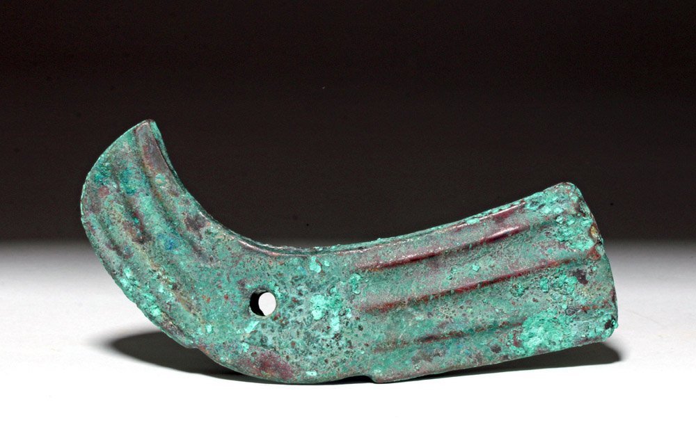 Bactrian Bronze Axe Head, ex-Piscopo: Bactria - Margiana, modern day central Asia, ca. 3rd to 2nd millennium BCE. This is a bronze axe head with a distinctive ridged surface and a downward curved back. As ever, central Asia was a crossroa