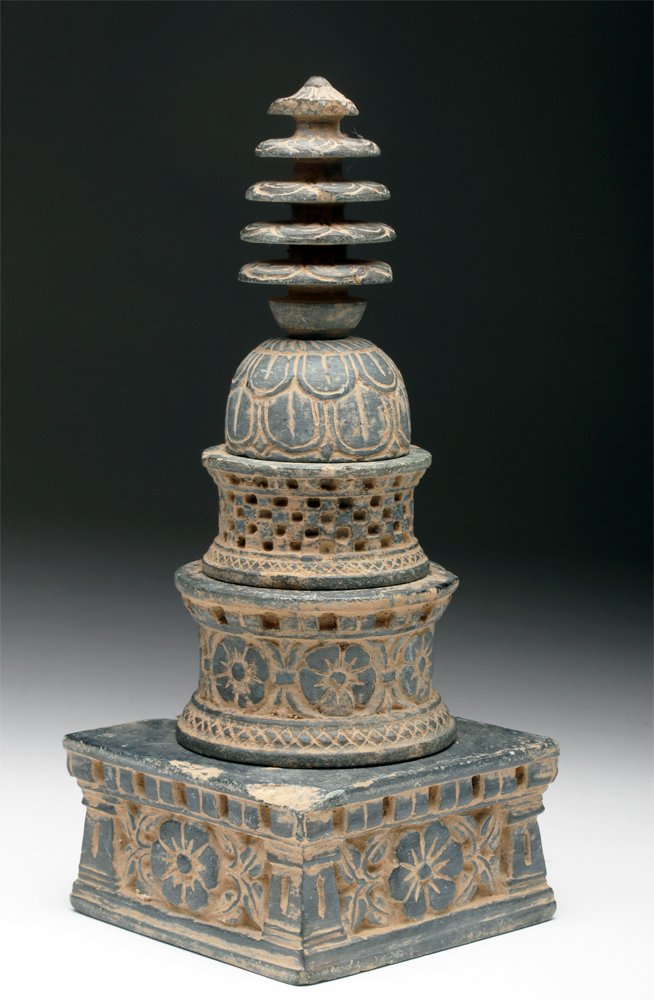 Ancient Gandharan Schist Stupa Model: Pakistan, ancient region of Gandhara, ca. 4th century CE. A model of a Buddhist stupa, finely carved from grey schist in five sections, the square base with four double columns at corners, the walls e