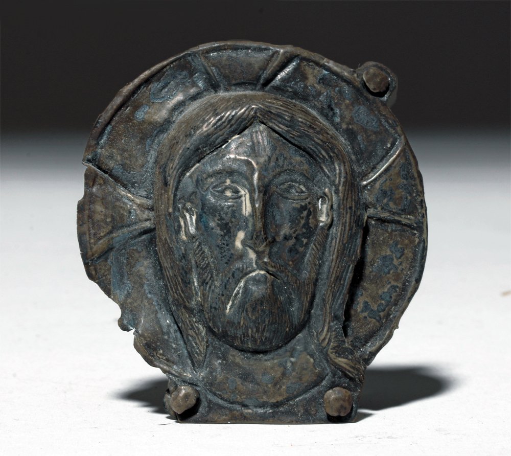 Rare Byzantine Silver Relief of Jesus: Eastern Roman Empire, Byzantium, ca. 10th to 12th century CE. A silver medallion with a repousse image of Jesus Christ, seemingly the head of a traditionally half-length Pantocrator form. The most acc
