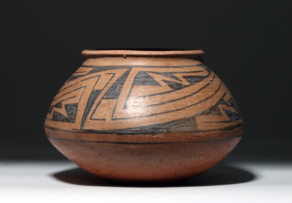 Casas Grande Bichrome Pottery Bowl: Pre-Columbian, Northern Mexico, Casas Grandes, ca. 1100 to 1200 CE. A bichrome decorated Casas Grandes pottery vessel of an attractive form, where the body bows outward and inward and resolves to a sl
